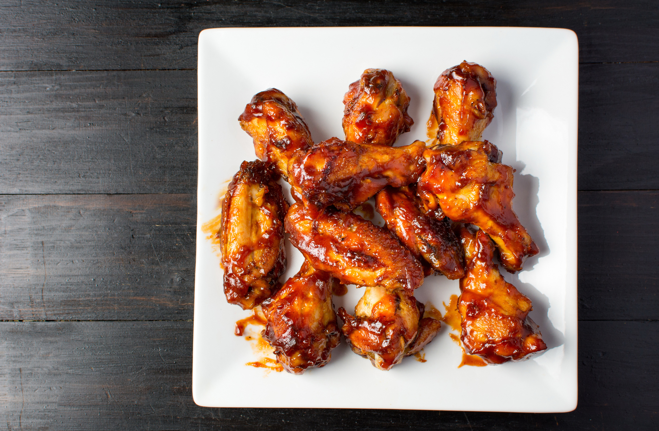Baked chicken wings on a white plate