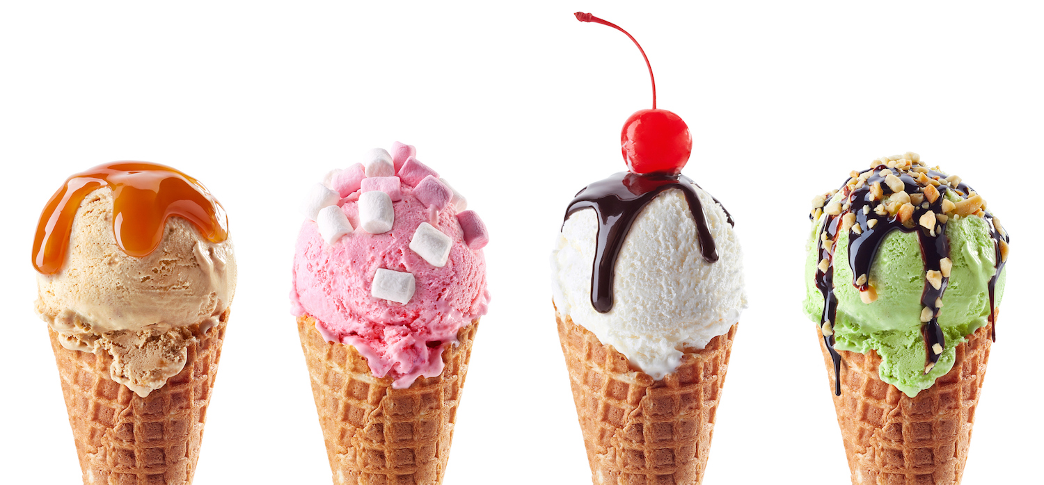 Set of four various ice cream scoops in waffle cones