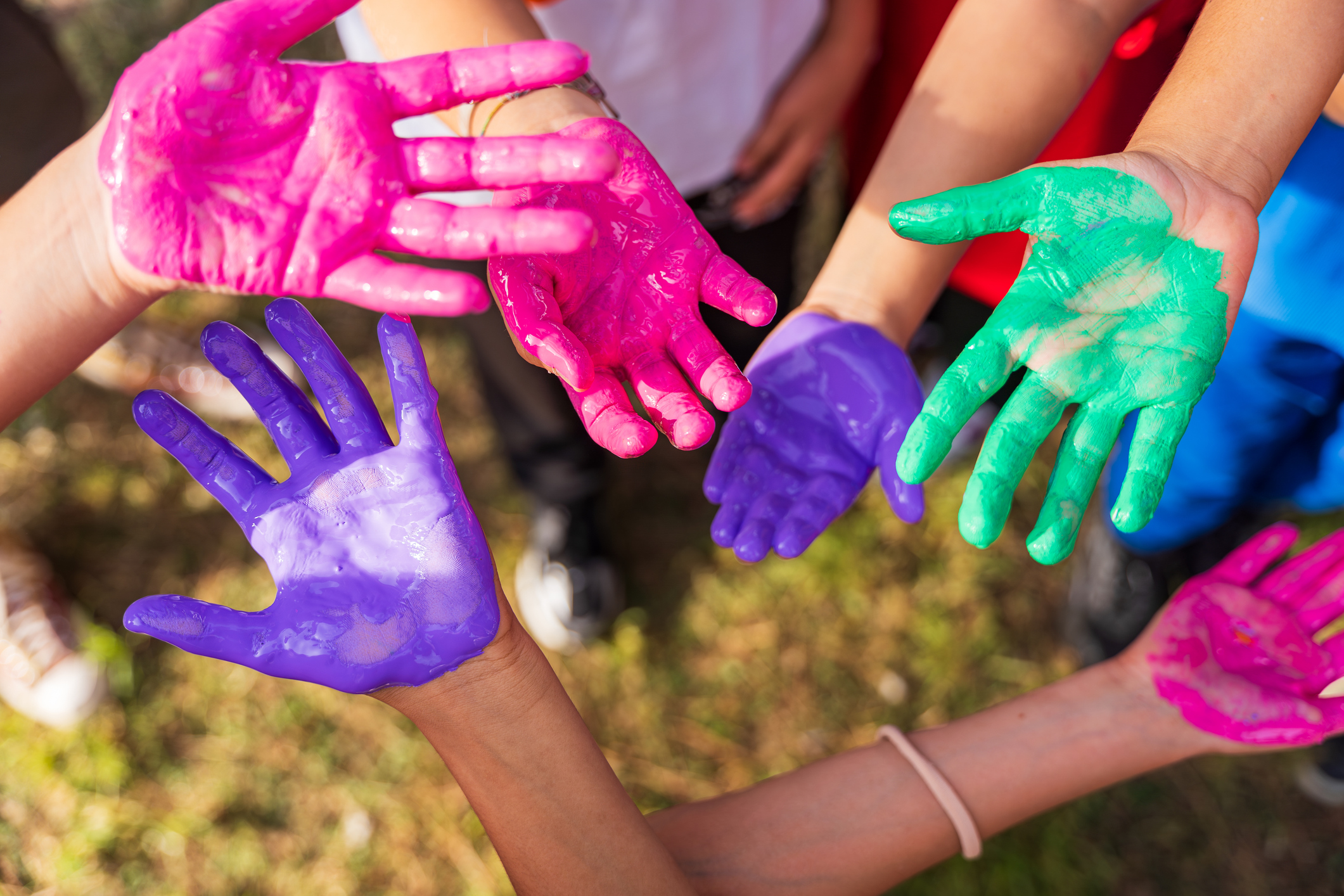 Kids hands colored in various colors.