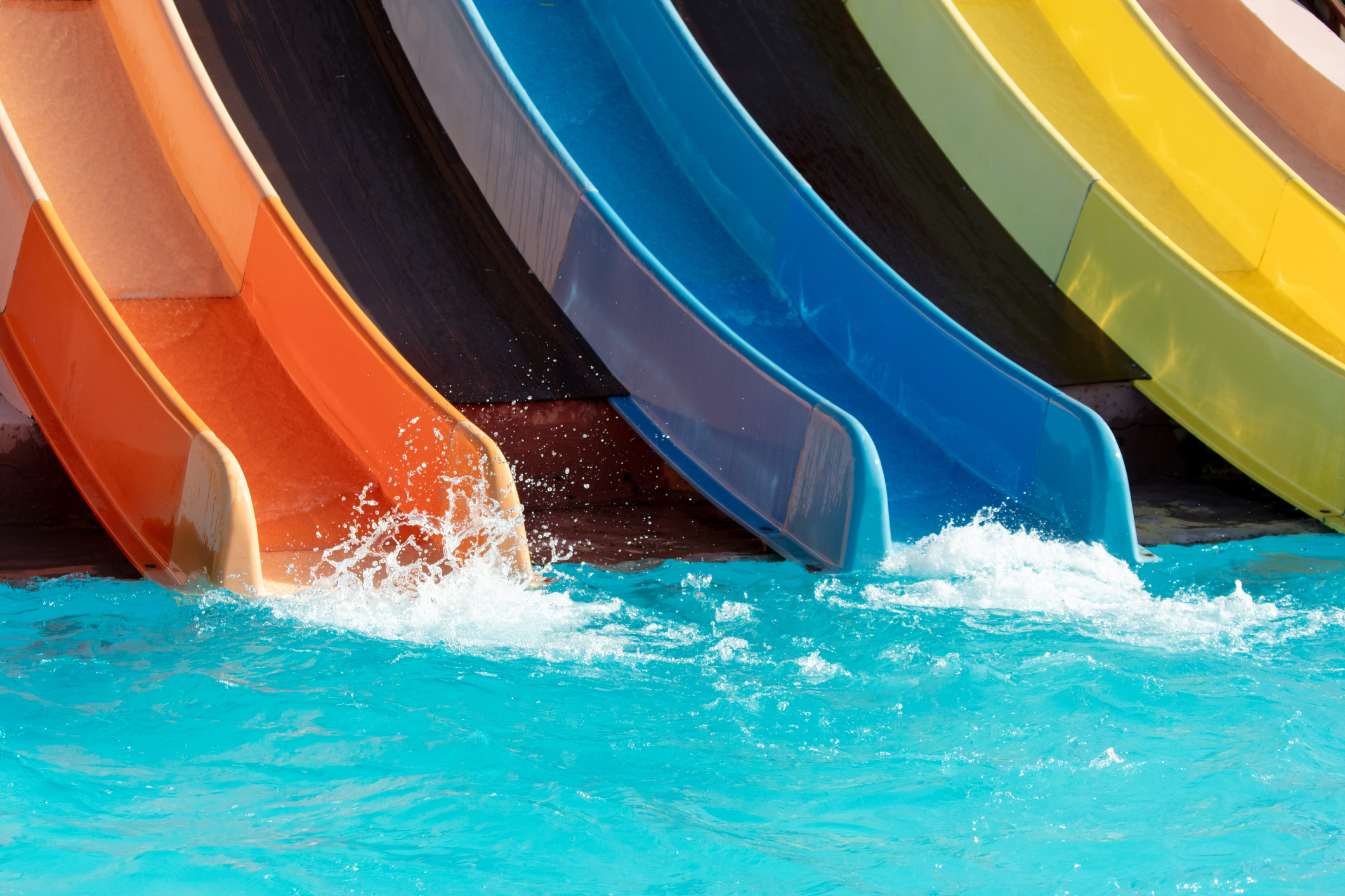 Red and blue slide in the pool of the water park