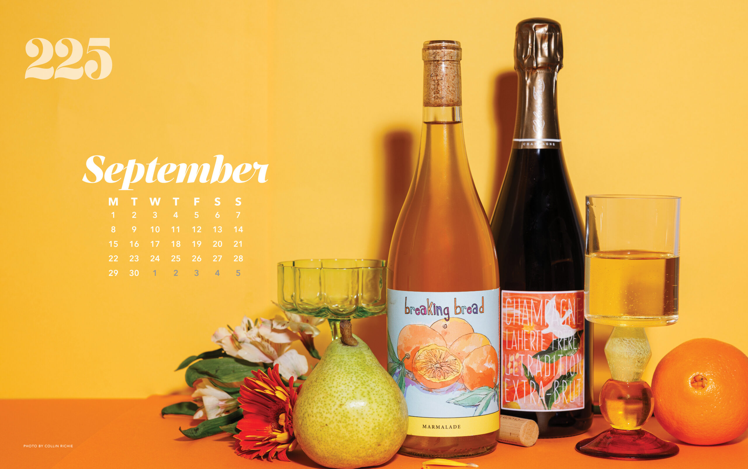 Wallpaper background with wine bottles, fruit and colorful glasses, yellow background